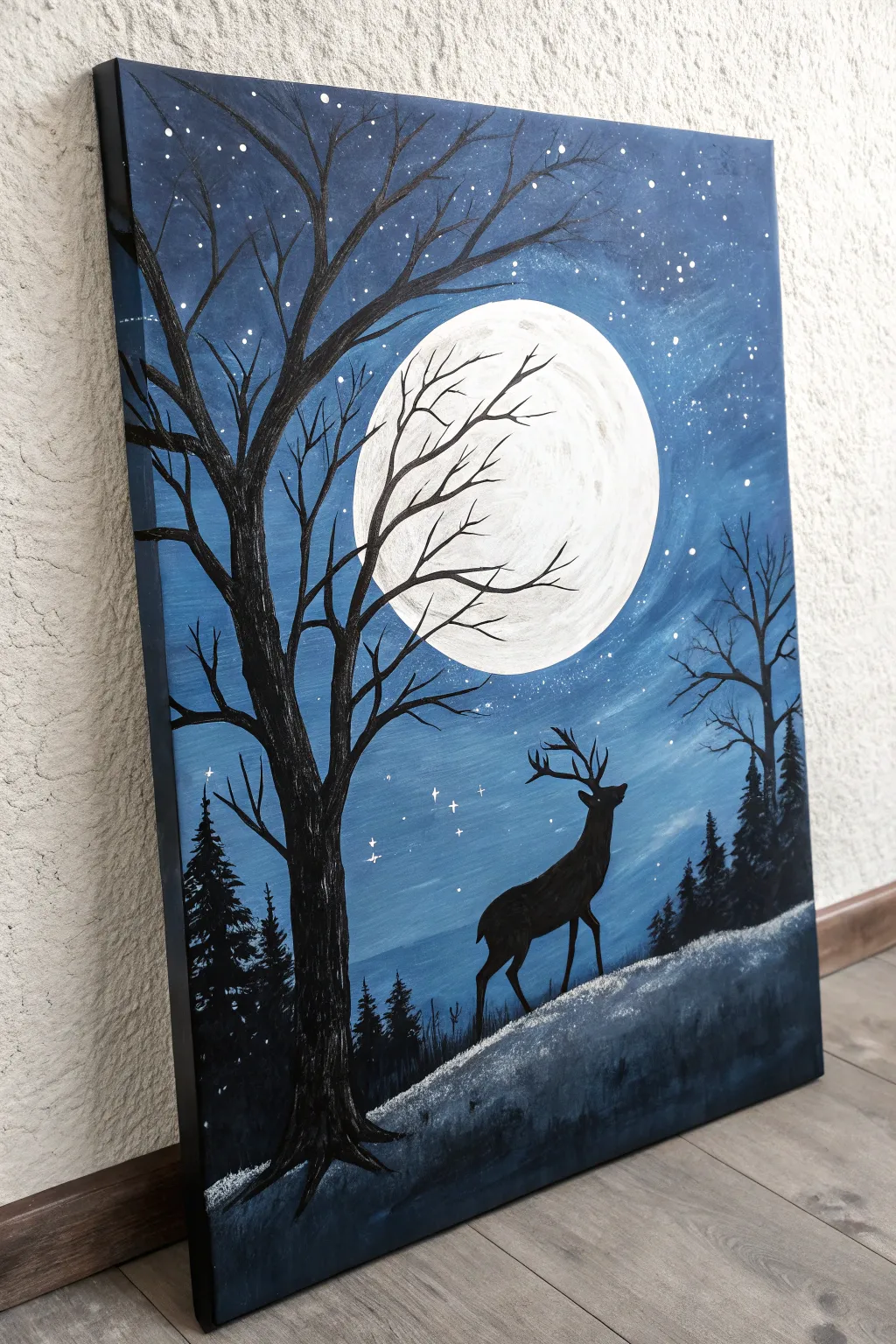 Capture the magic of winter with this bold moonlit silhouette painting idea. Easy and stunning.