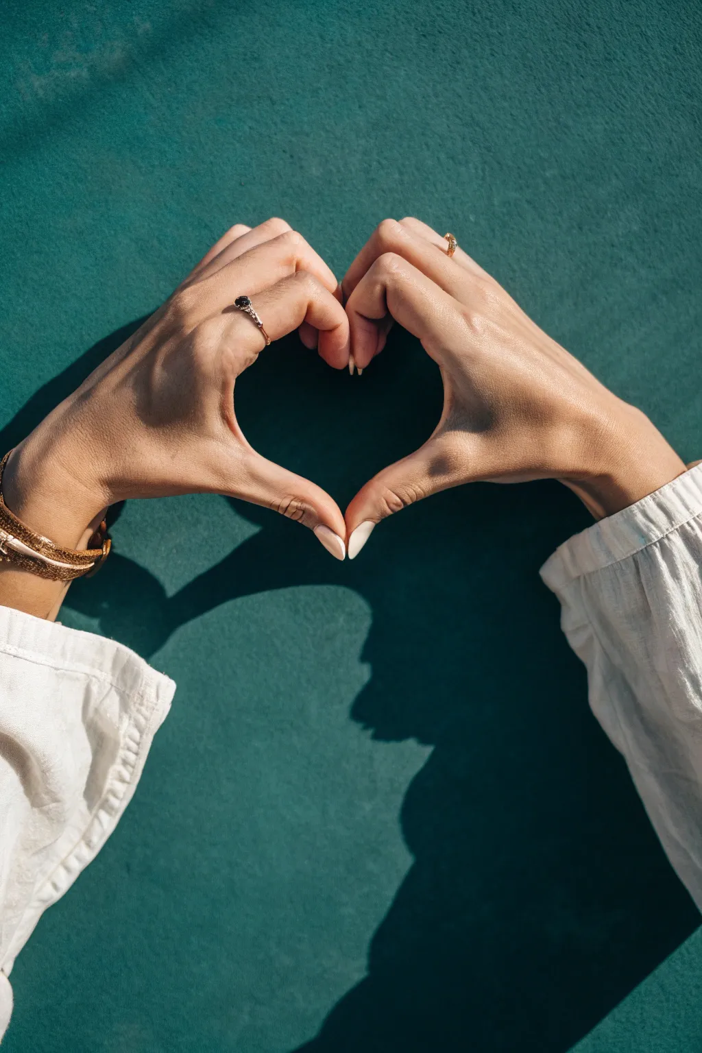 Two hands forming one heart silhouette, a simple connection drawing idea that feels warm and modern