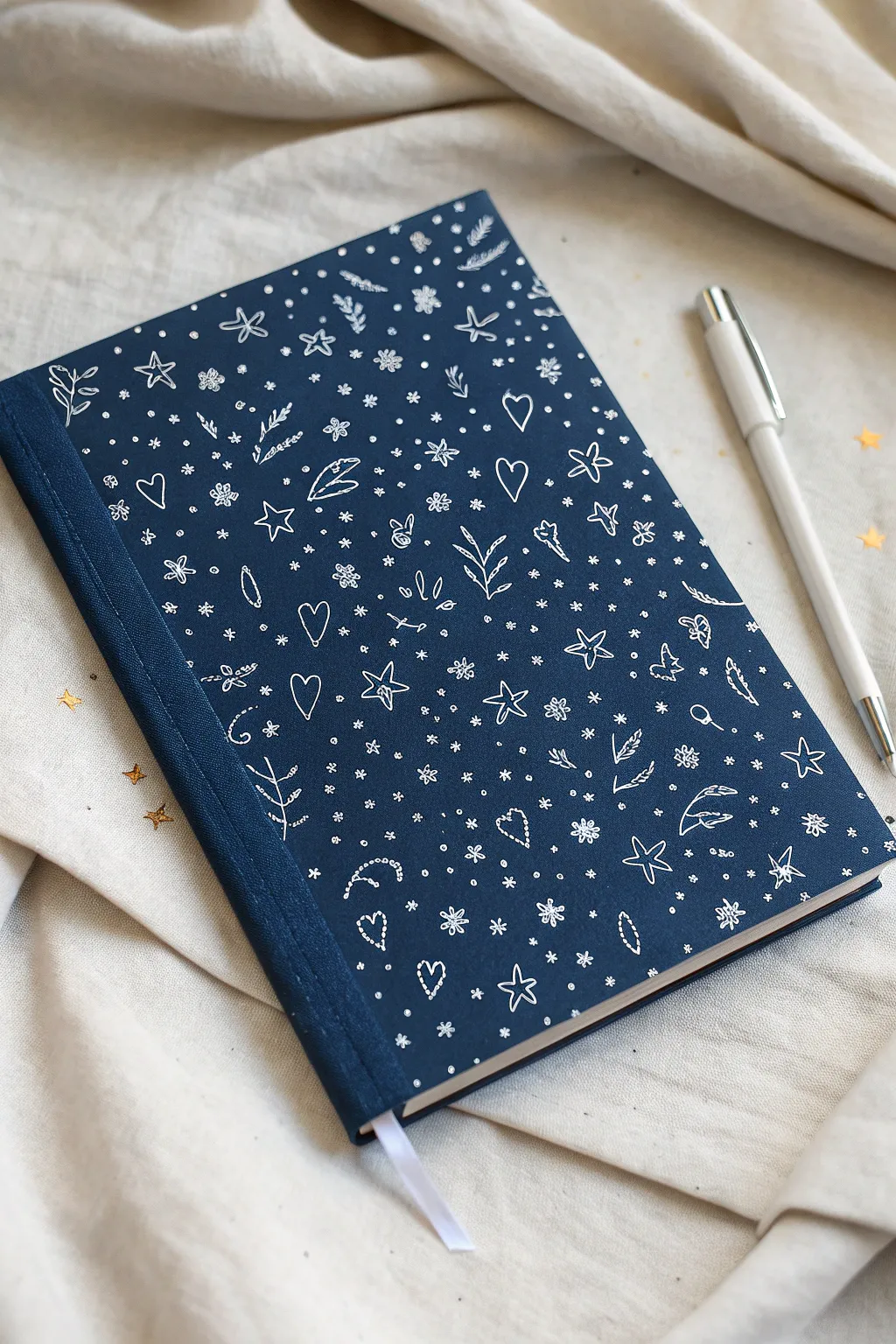 Tiny stars, hearts, and sparkles in a seamless doodle pattern for the cutest sketchbook cover.