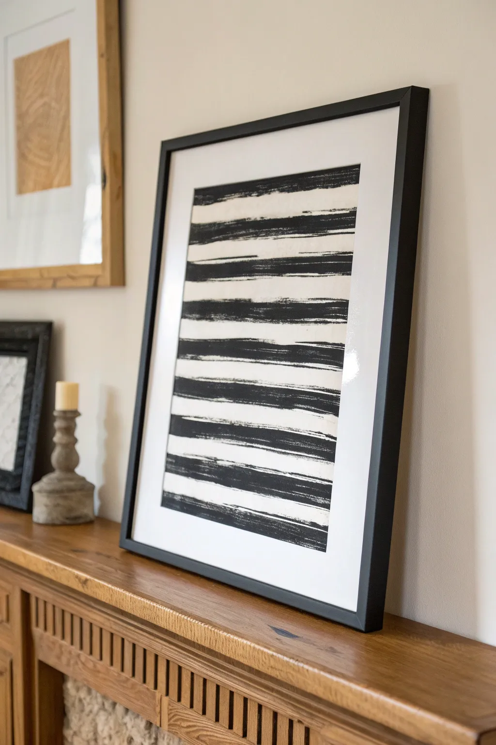 Bold DIY black-and-white marks in a simple frame for striking minimalist mantel styling