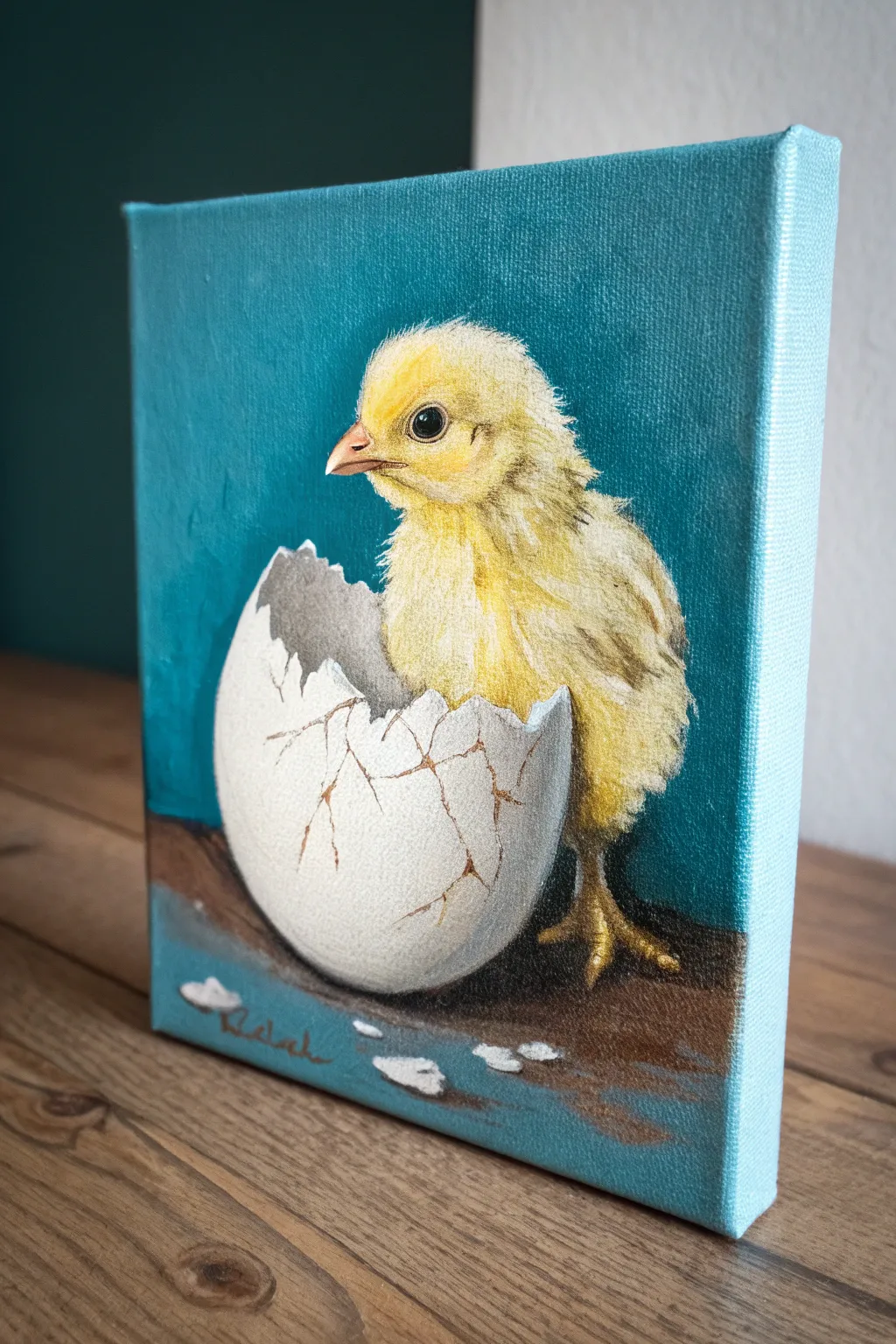 Baby chick peeking from a cracked egg on canvas, bold teal backdrop for a modern Easter painting