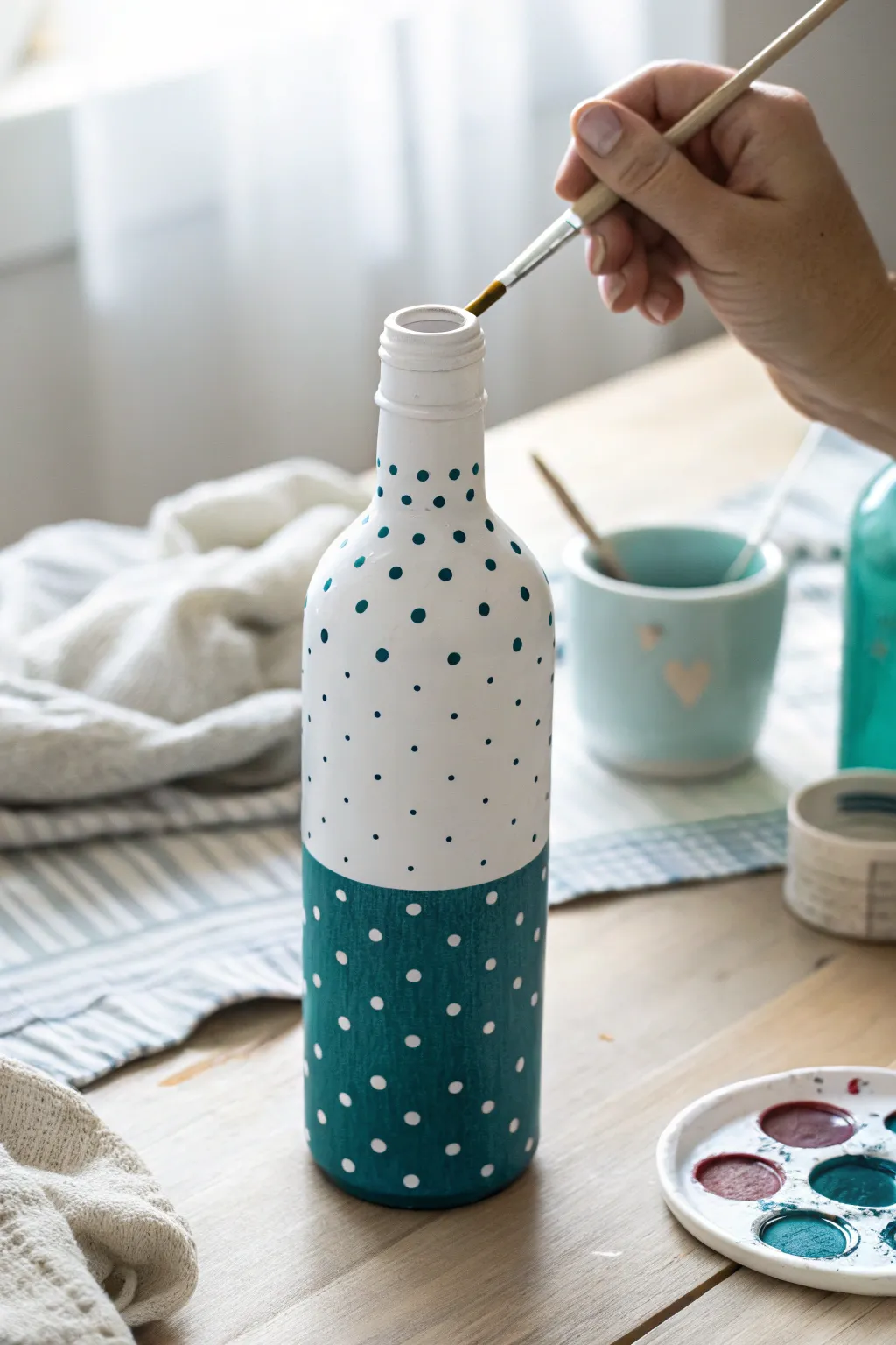Perfect polka dots on a painted bottle with a cotton swab, simple, neat, and Pinterest pretty.
