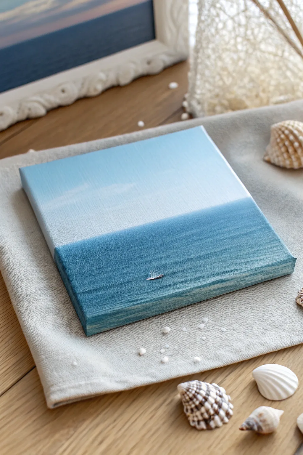 Minimal ocean horizon painting with tiny sparkle dabs, coastal calm in bold blue tones.