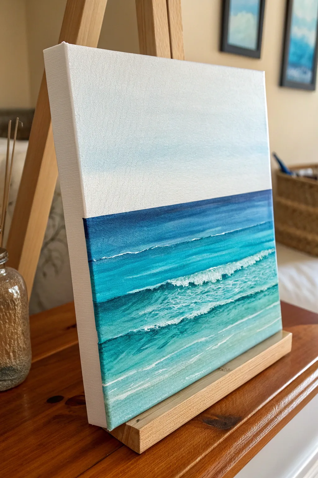 Minimal ocean seascape painting with simple wave lines in bold blues for a calm, spa vibe.