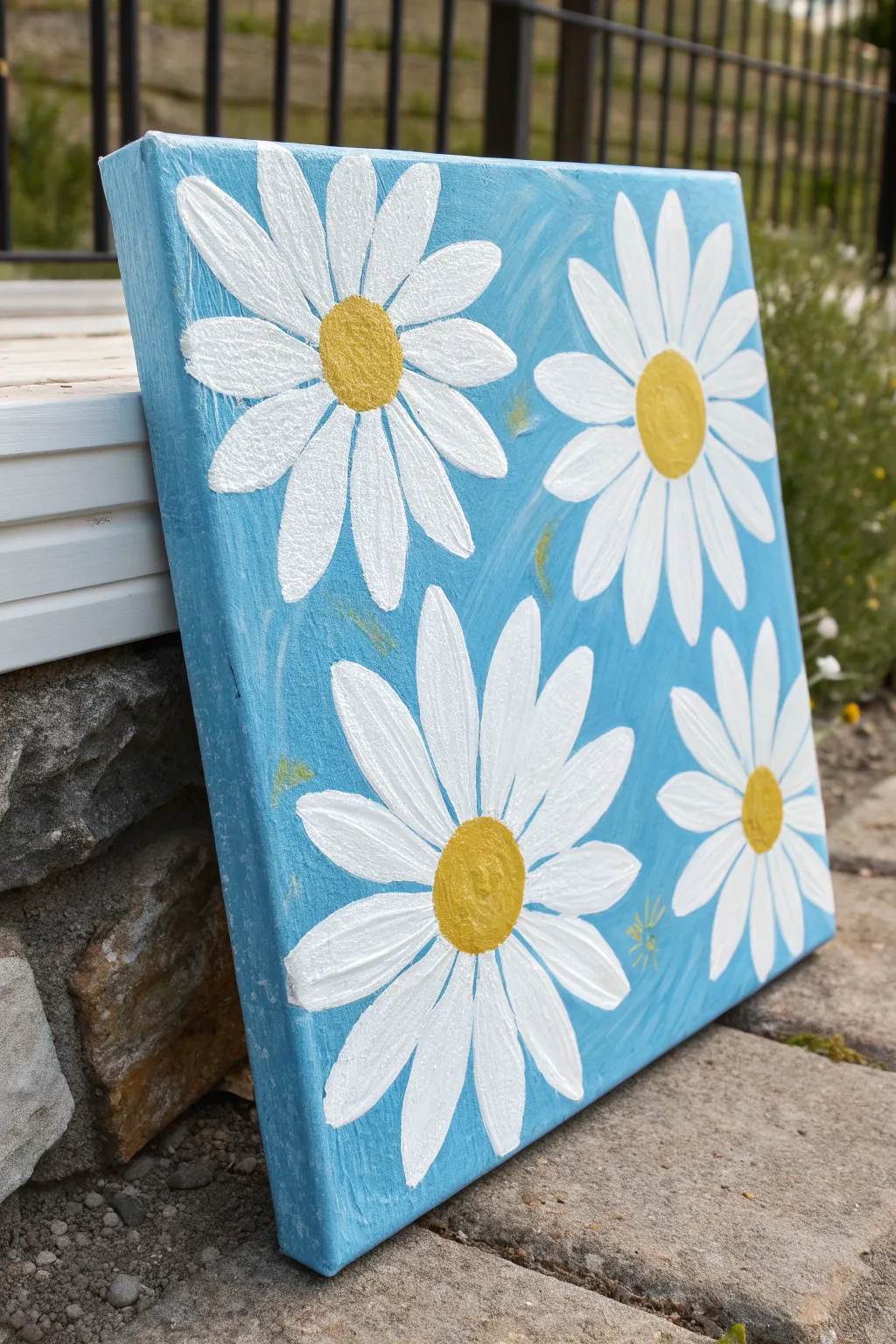 Big simple daisies on sky blue, bold brushstrokes for an easy spring painting vibe.