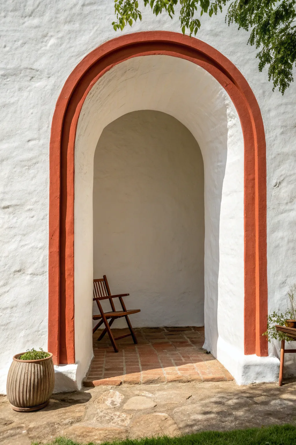 Terracotta painted arch nook with clean Scandinavian simplicity and a cozy boho touch in bold contrast