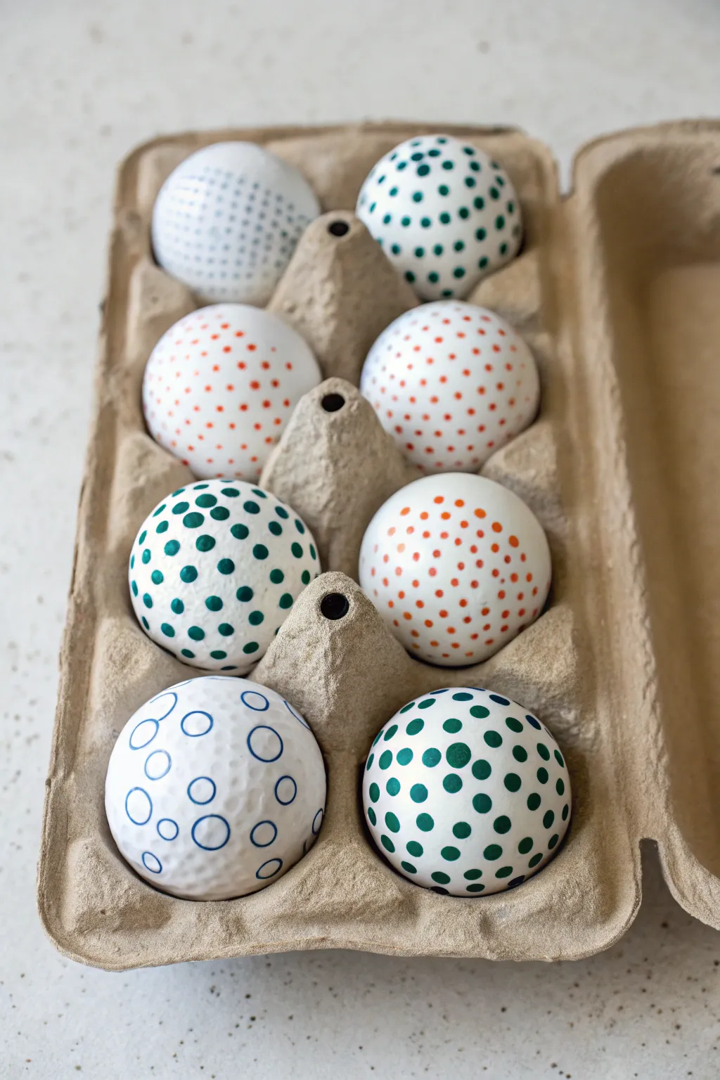 Polka dot golf ball designs in a neat grid for fast, stylish identification on the course