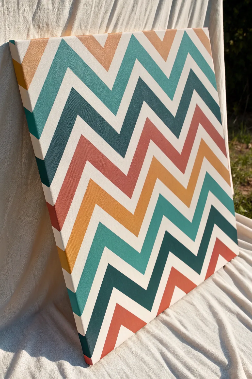 Bold chevron zigzags in flat color blocks with crisp tape lines for a striking hard edge look