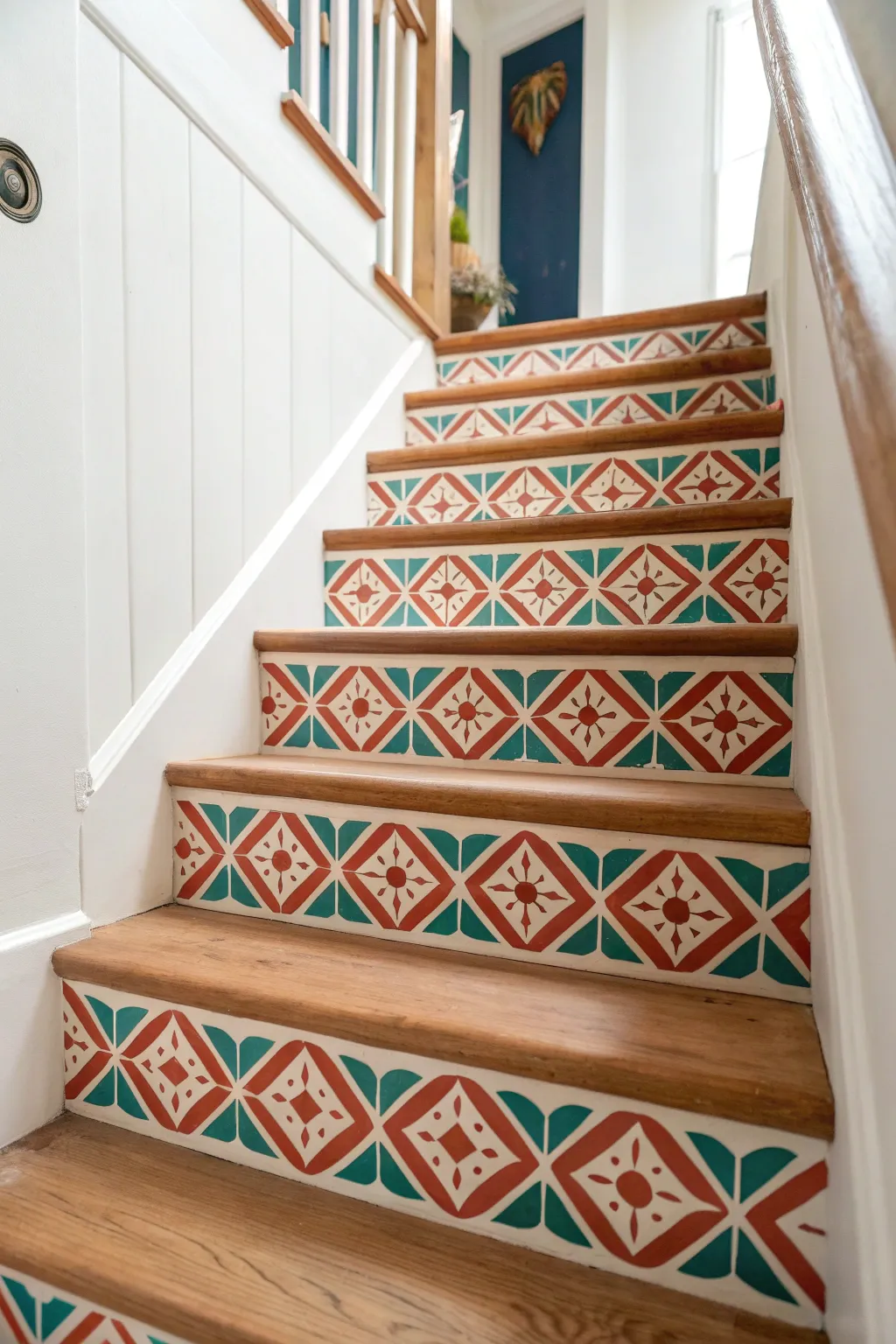 Painted patterned stair risers bring bold Scandinavian minimal style to a calm stairwell.