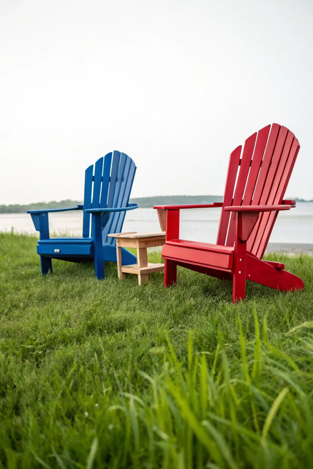 Bold primary colors turn this Adirondack chair duo into a cheerful, classic outdoor seating pop