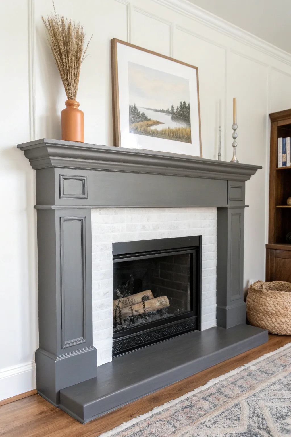 Charcoal gray mantel styling that feels modern and grounded against crisp white and black.