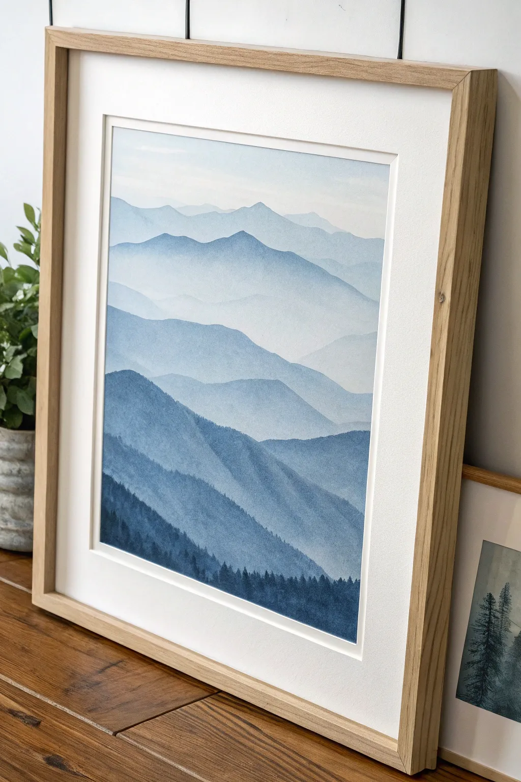Soft mist and cool mountain layers in a clean Scandinavian frame, calming yet bold contrast.