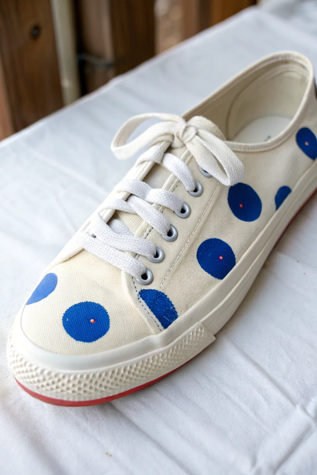 Two-size polka dots on canvas shoes for a bold, playful look with clean minimalist vibes