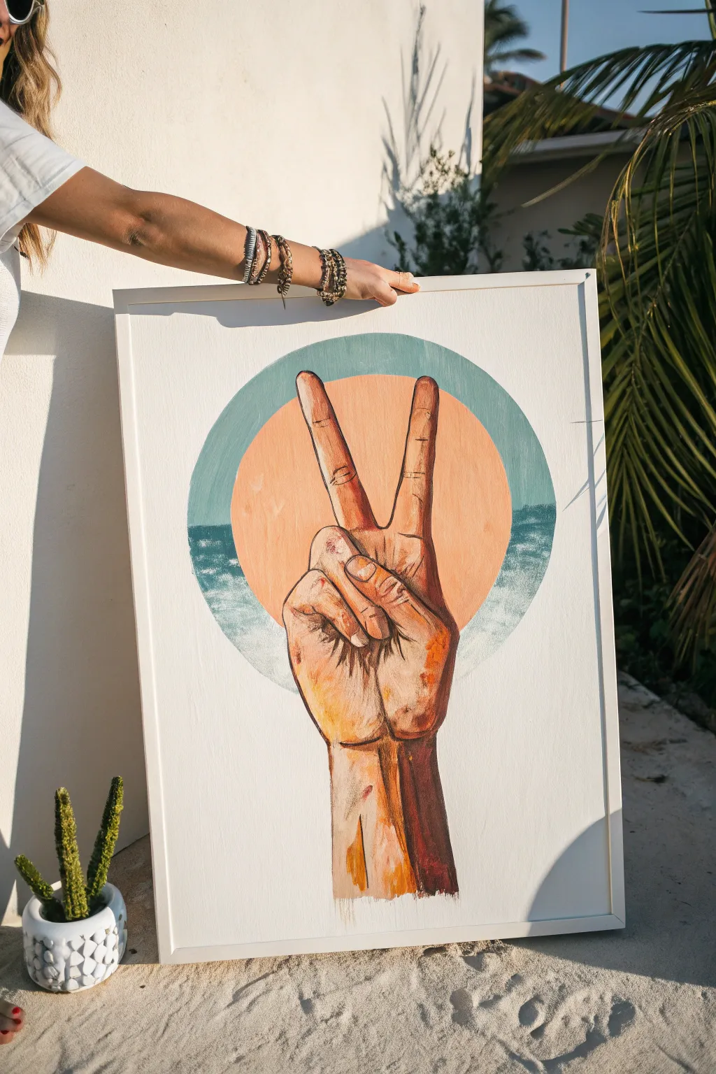 Minimal peace-sign hand painting in warm tones on a calm neutral backdrop, bold yet serene