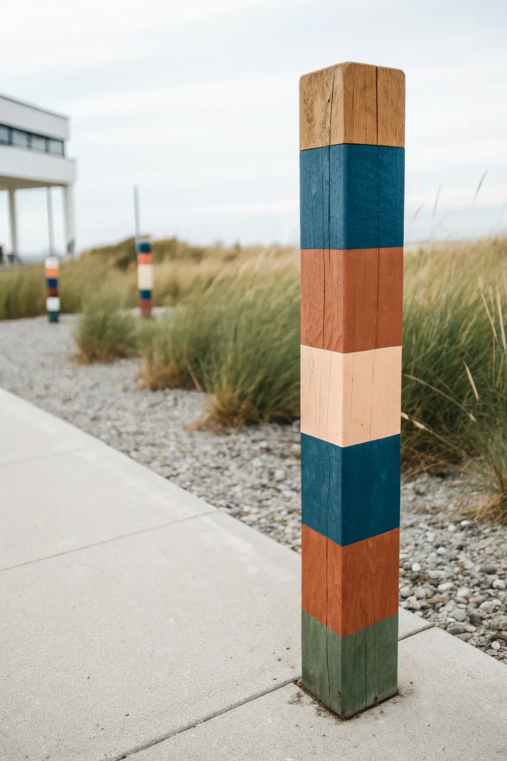 Modern color-blocking bands turn a simple pole into a bold, minimalist outdoor statement.