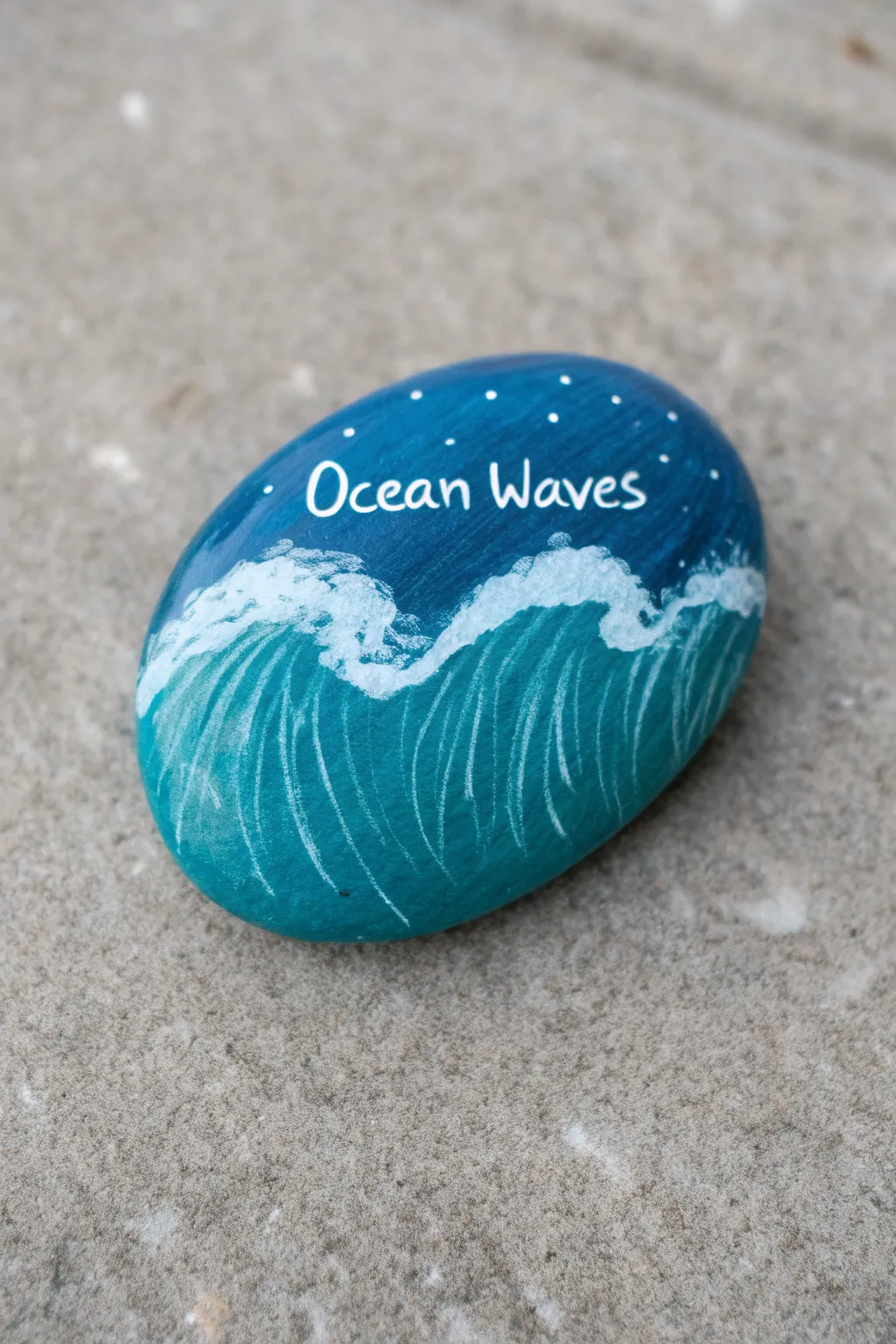 Teal and cobalt beach-wave rock with a simple white script quote, minimal Scandinavian vibes