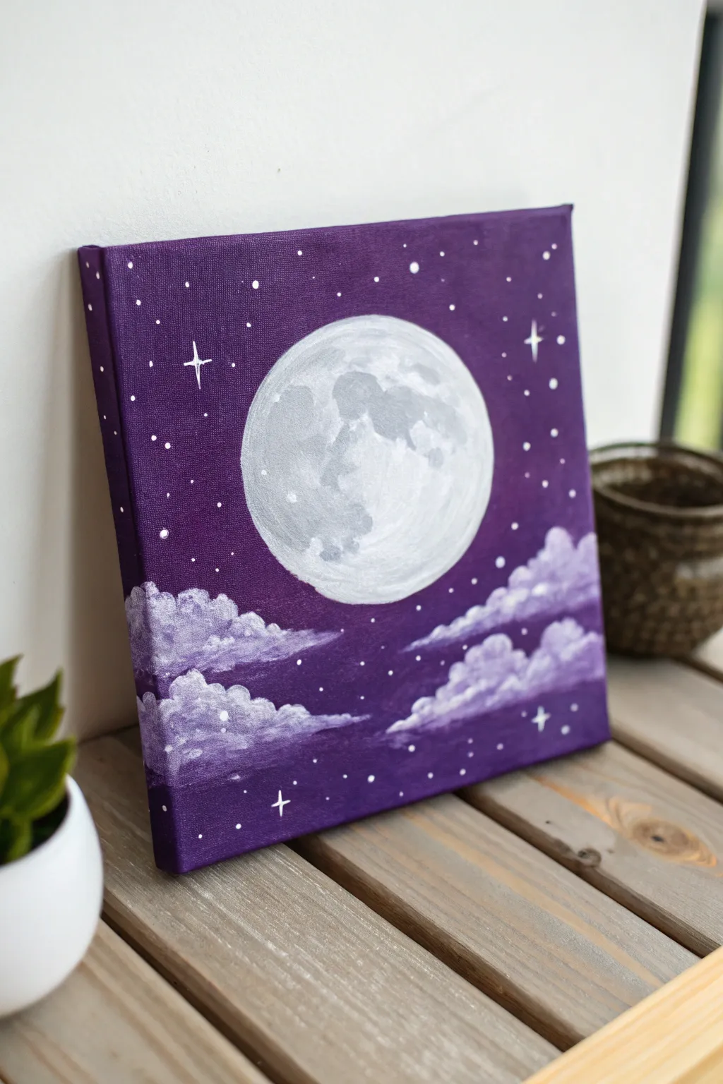 Full moon acrylic idea: glowing white moon against a bold purple sky with stars and soft clouds