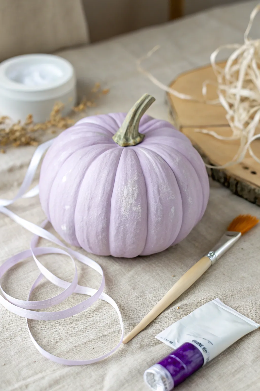 Lavender pumpkin with flowing white swirls for a clean minimalist boho fall look