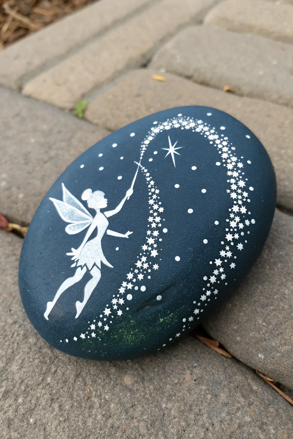 Midnight fairy silhouette rock with fading sparkle trail for magical Disney-inspired painting