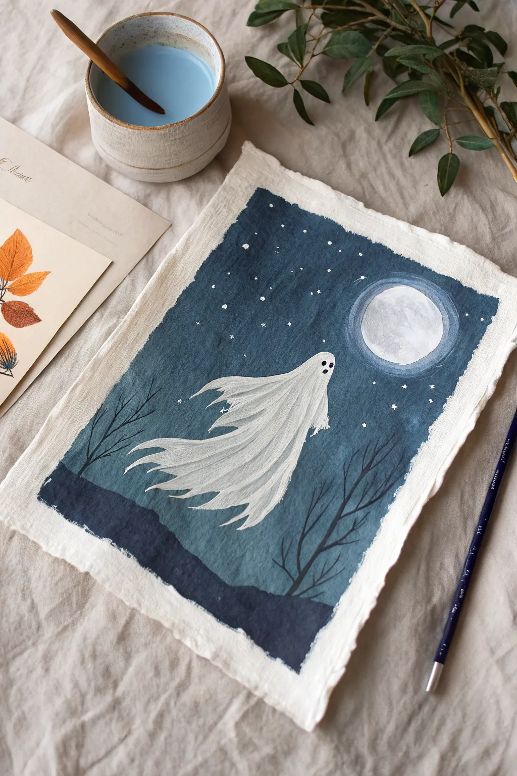 Moonlit ghost with tattered edges, a minimalist scary Halloween drawing idea with bold contrast.