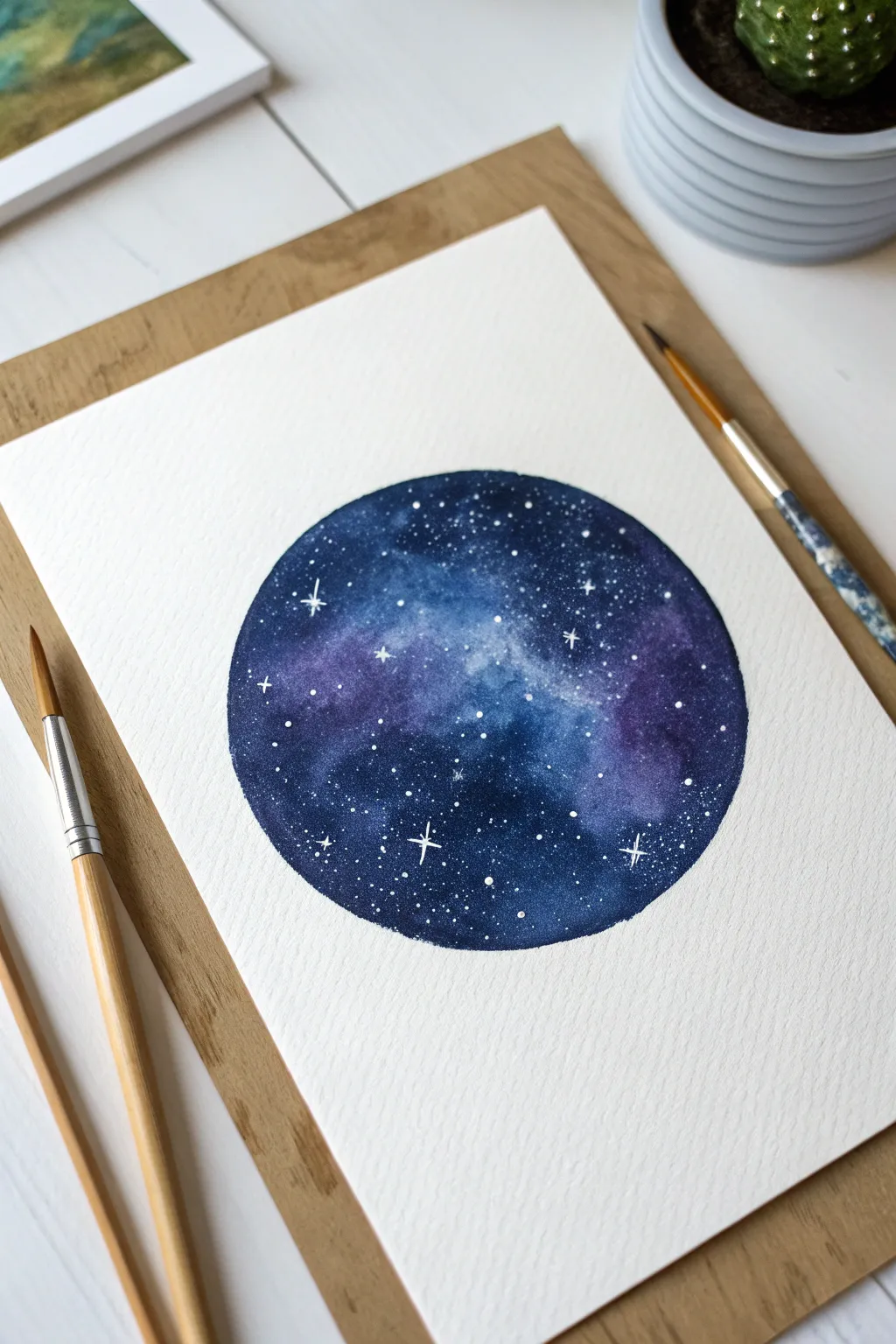Create your own mini cosmos with this bold starry galaxy painting.