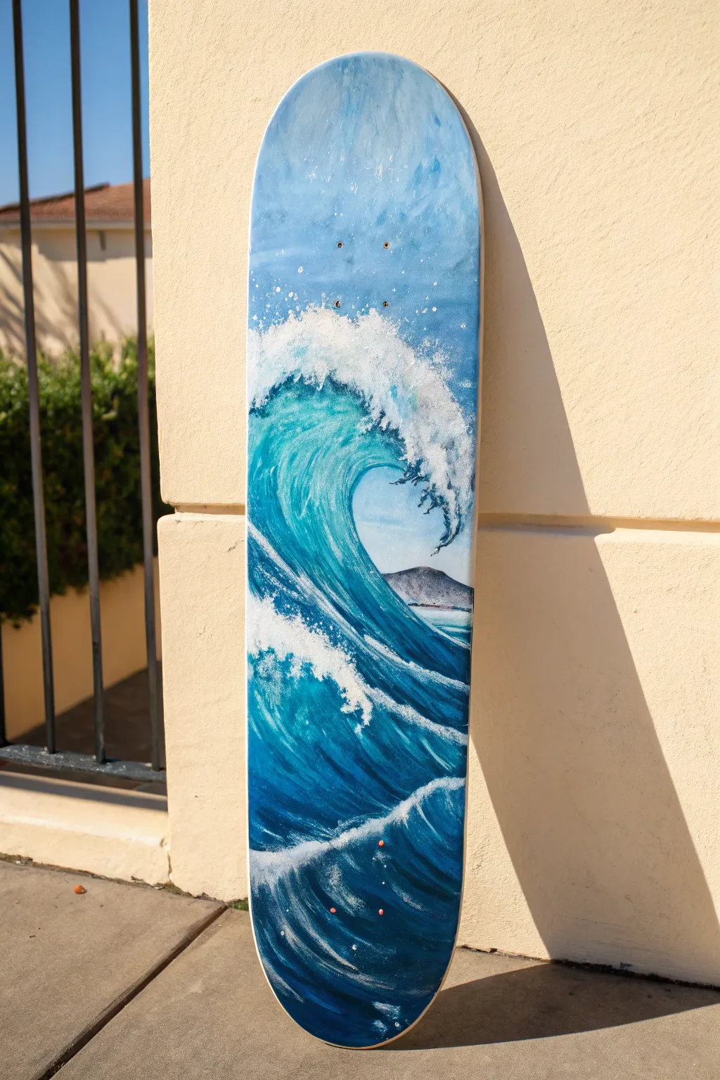 Ocean wave skateboard deck art that uses the nose curve for a bold, flowing crest