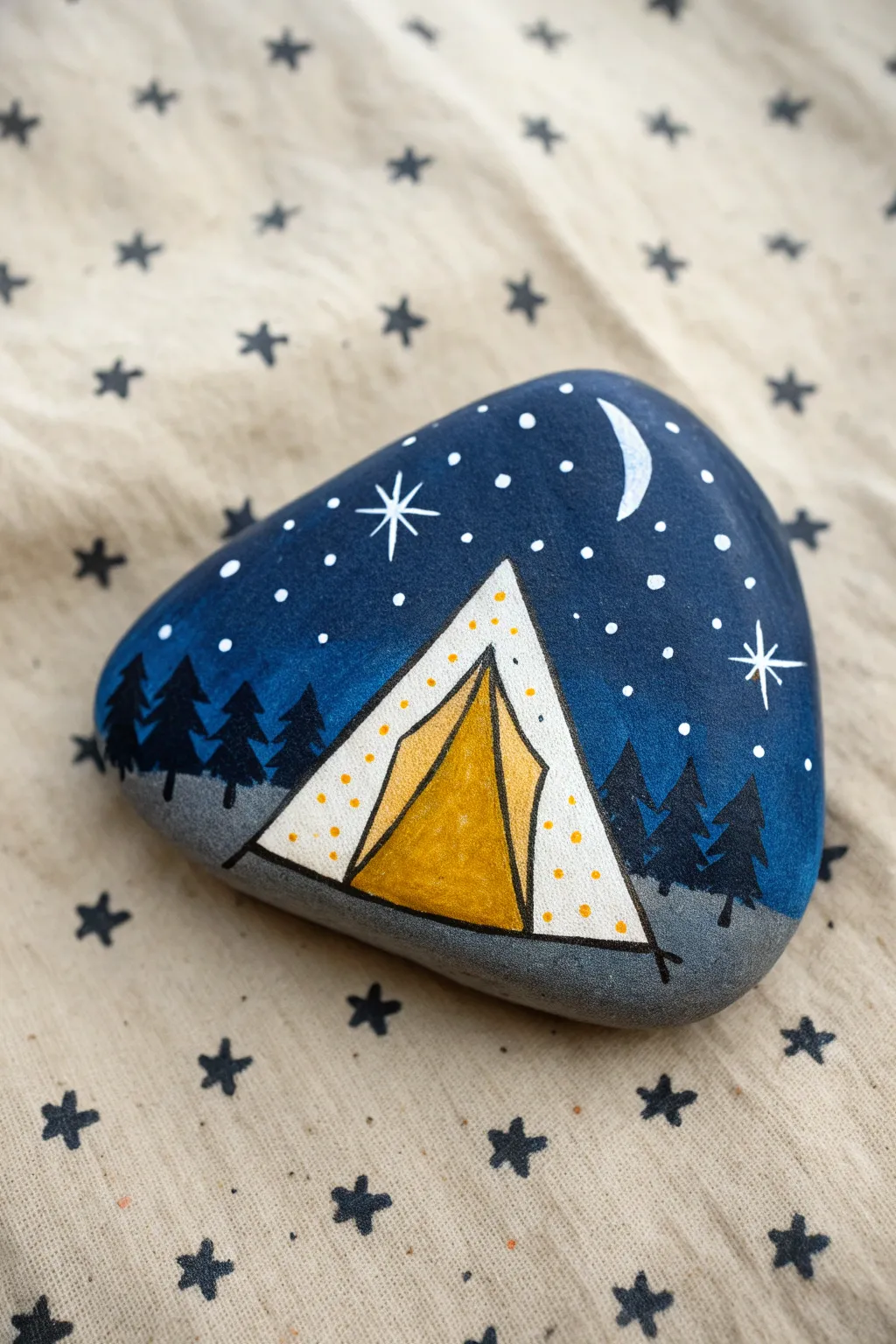Triangle tent rock with warm glow and starry night vibes, minimalist boho craft inspiration.
