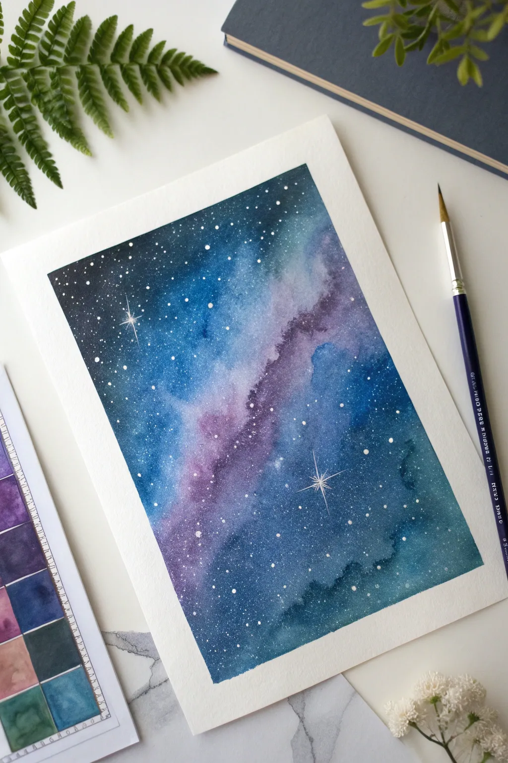 Layered indigo and violet galaxy sketch with watercolor pencils, softened blooms and crisp dry texture