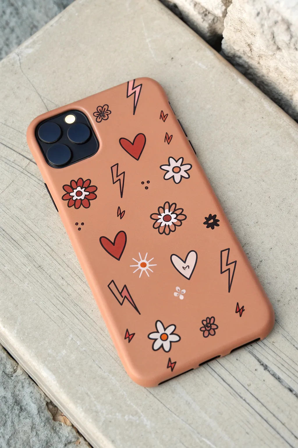 Bold paint-pen pop icons turn a simple phone case into a cute sticker-style statement.