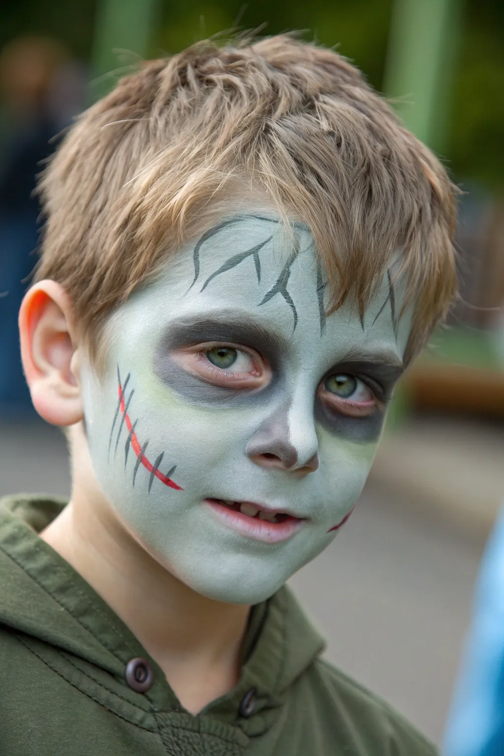 Kid-friendly zombie grime with soft crack lines and smoky eye sockets in a clean minimalist style