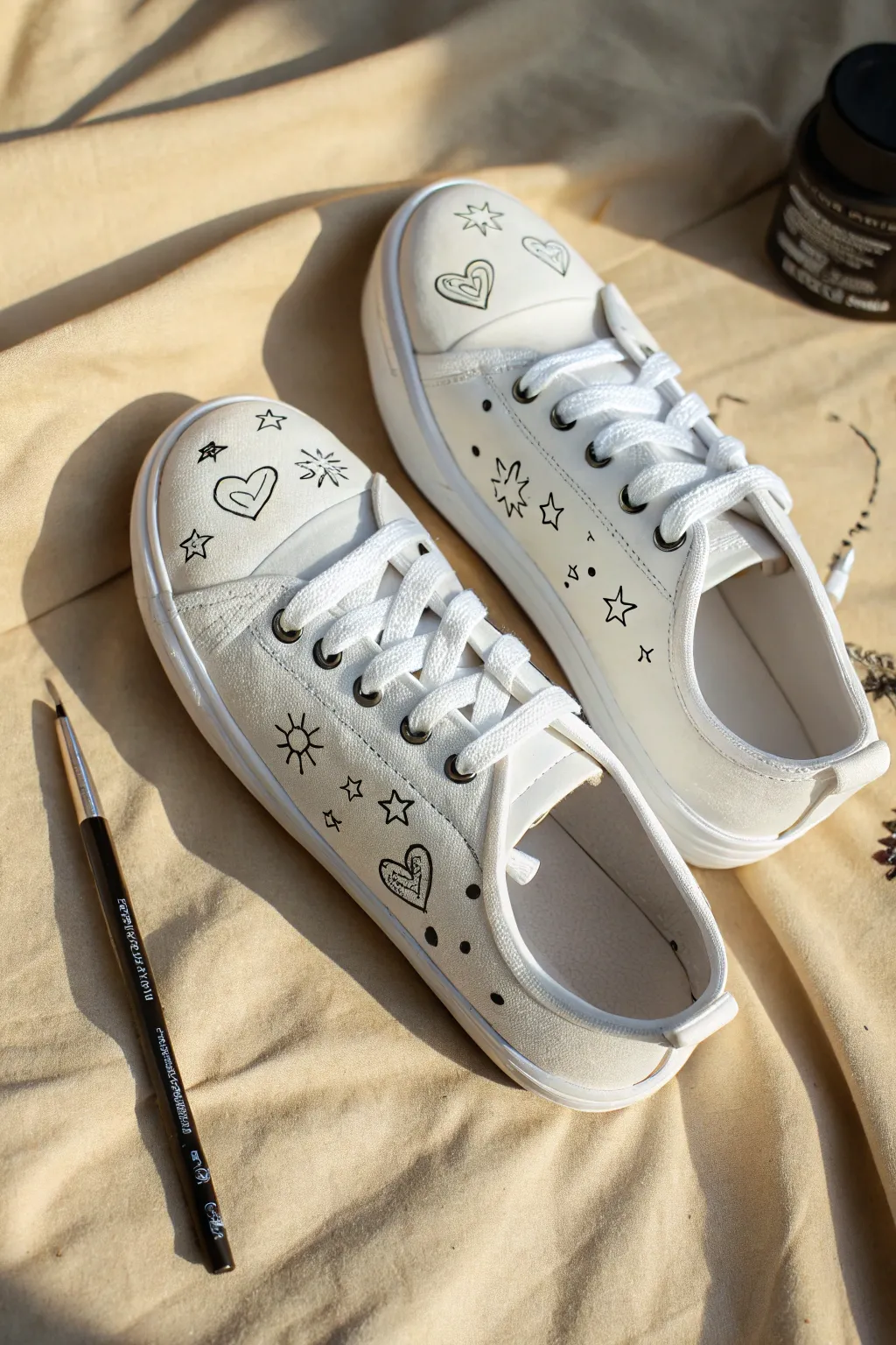 Tiny hearts and minimal doodles on white canvas shoes, clean negative space and handmade charm.