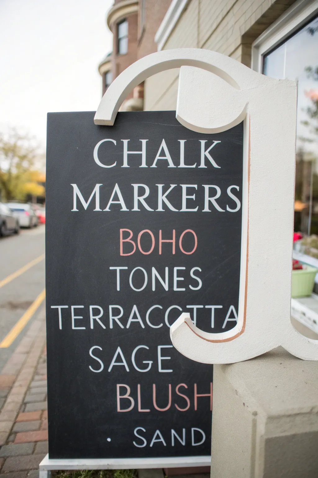 Bold chalk marker serif letter with color blocks for chic high contrast Scandinavian boho vibes