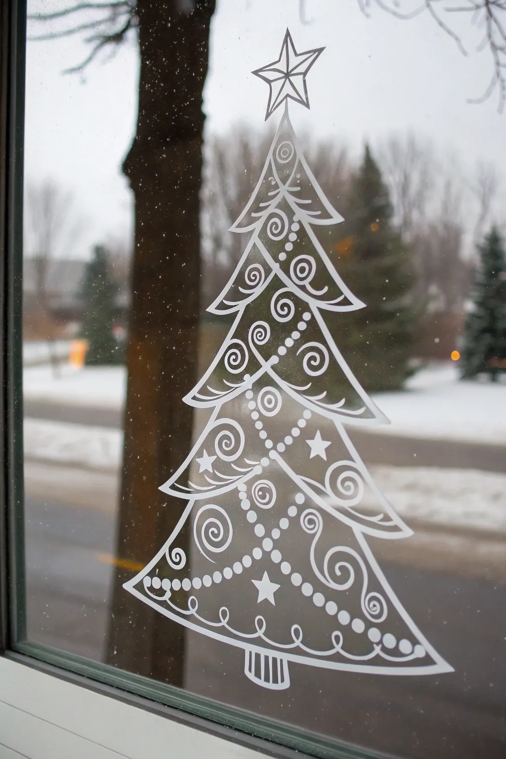 Minimal window Christmas tree drawing in white marker, simple garlands, ornaments, and star.