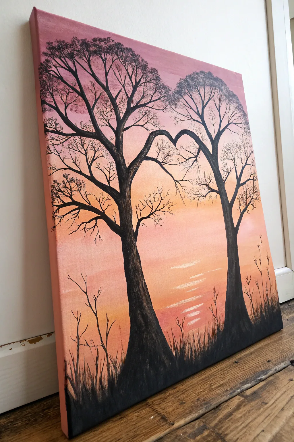 Two trees, one heart canopy at sunset, a minimalist couple painting idea with cozy boho warmth.