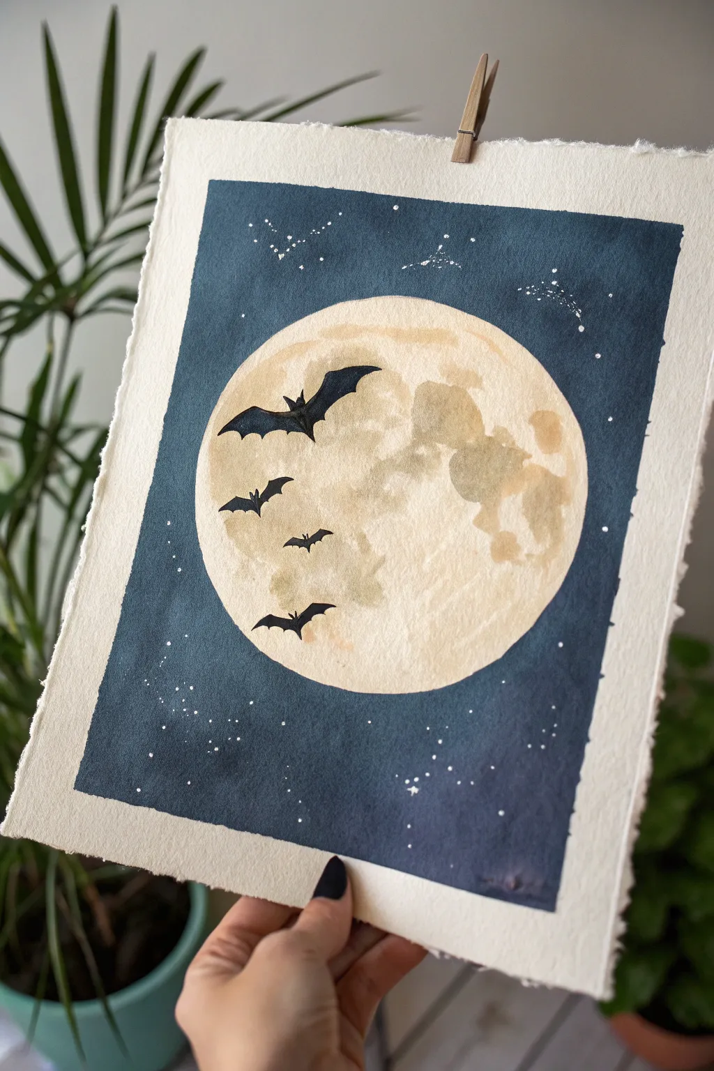 Hazy full moon with sharp bat silhouettes, minimalist and eerie with striking night-sky contrast.