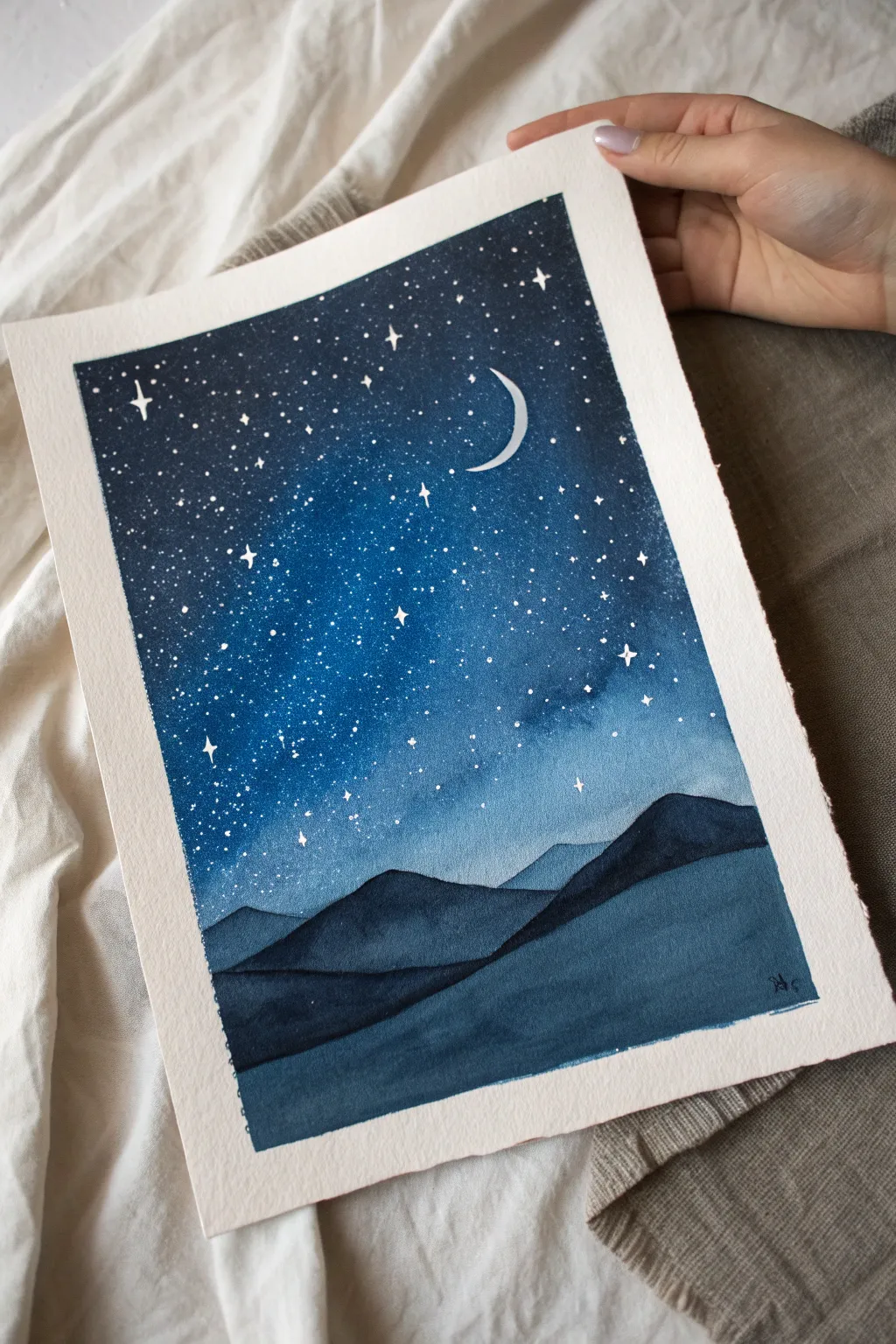 Minimalist watercolor of a starry desert night with a crescent moon, calm boho Scandinavian mood.