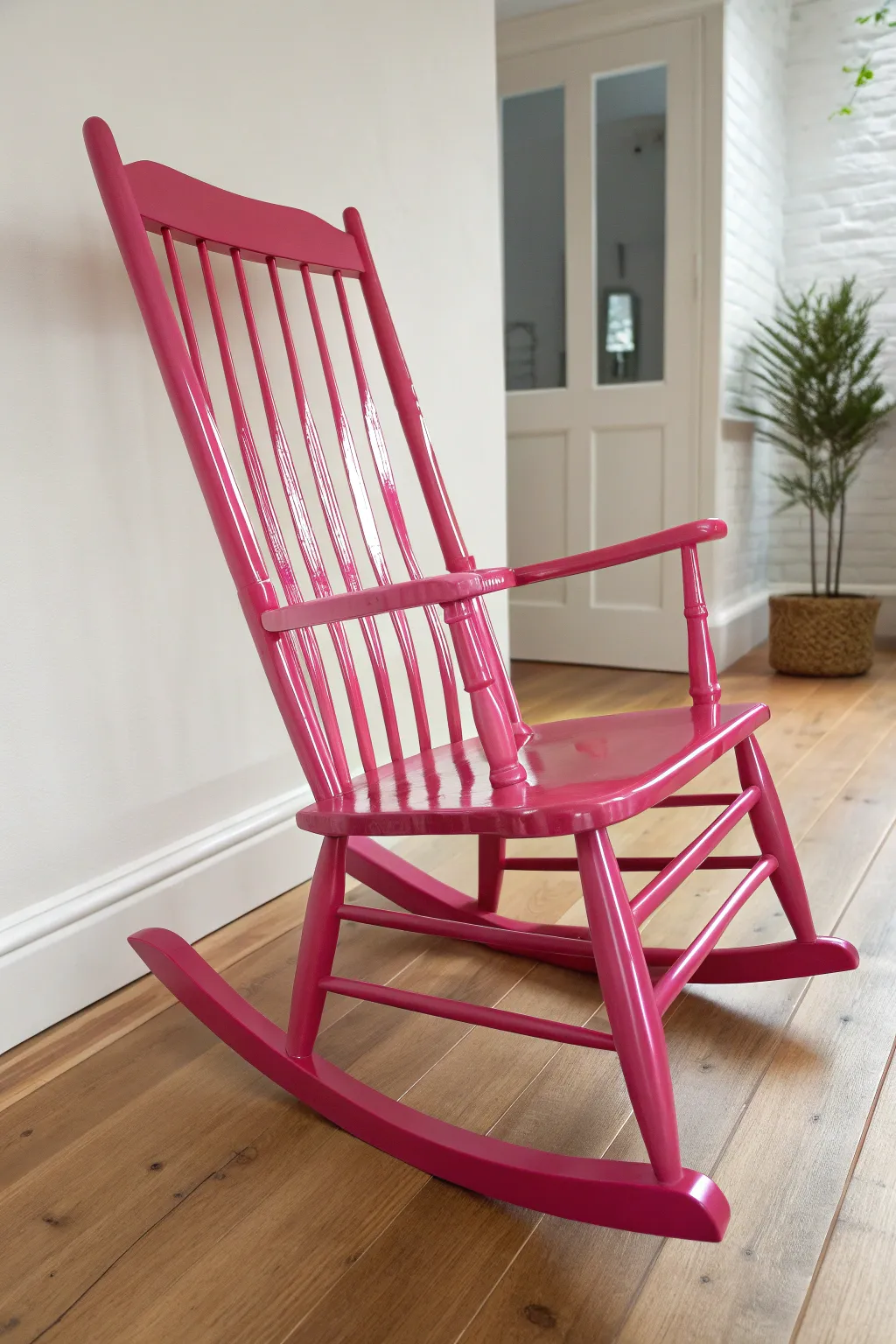 High-gloss pop color rocking chair with glassy reflections in a calm minimalist Scandinavian setting.