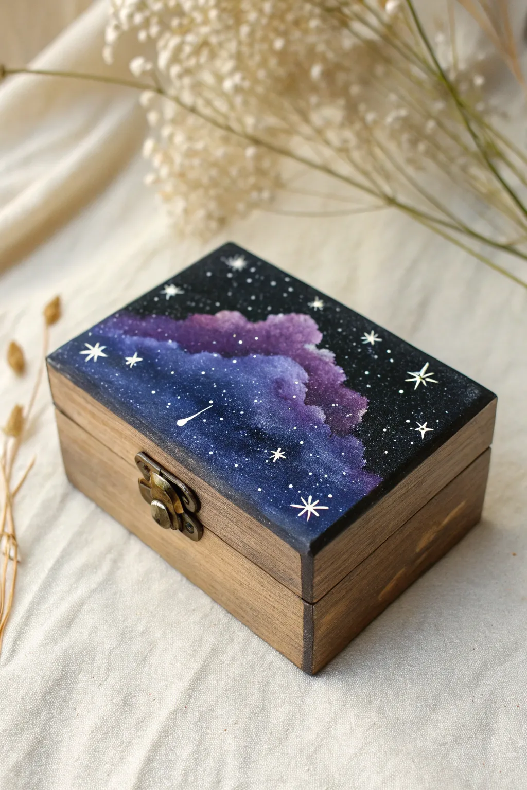 Transform a plain box into a starry night sky with this simple sponge technique.