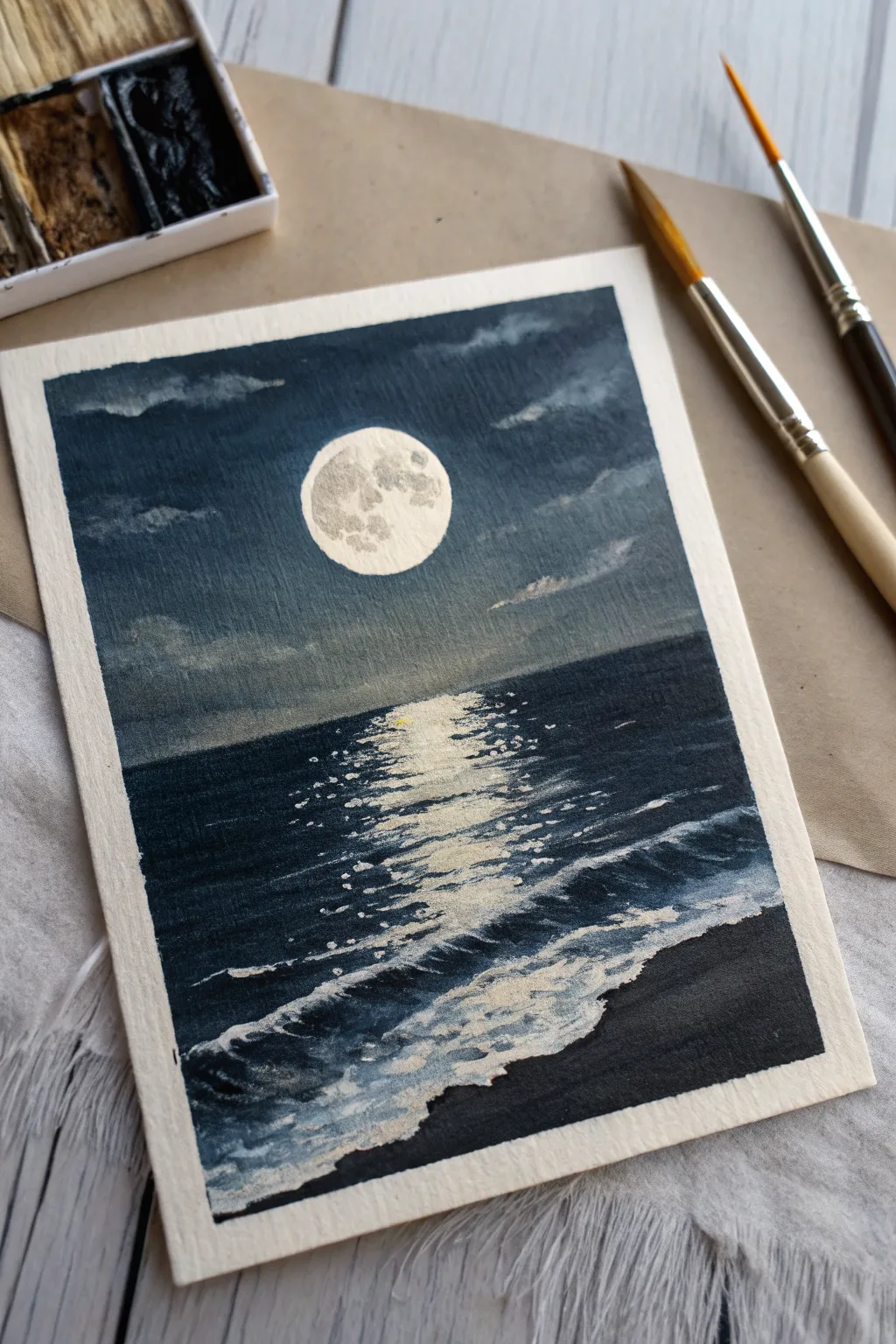 Paint a luminous moon path across a dark ocean with simple strokes and calming minimal detail.
