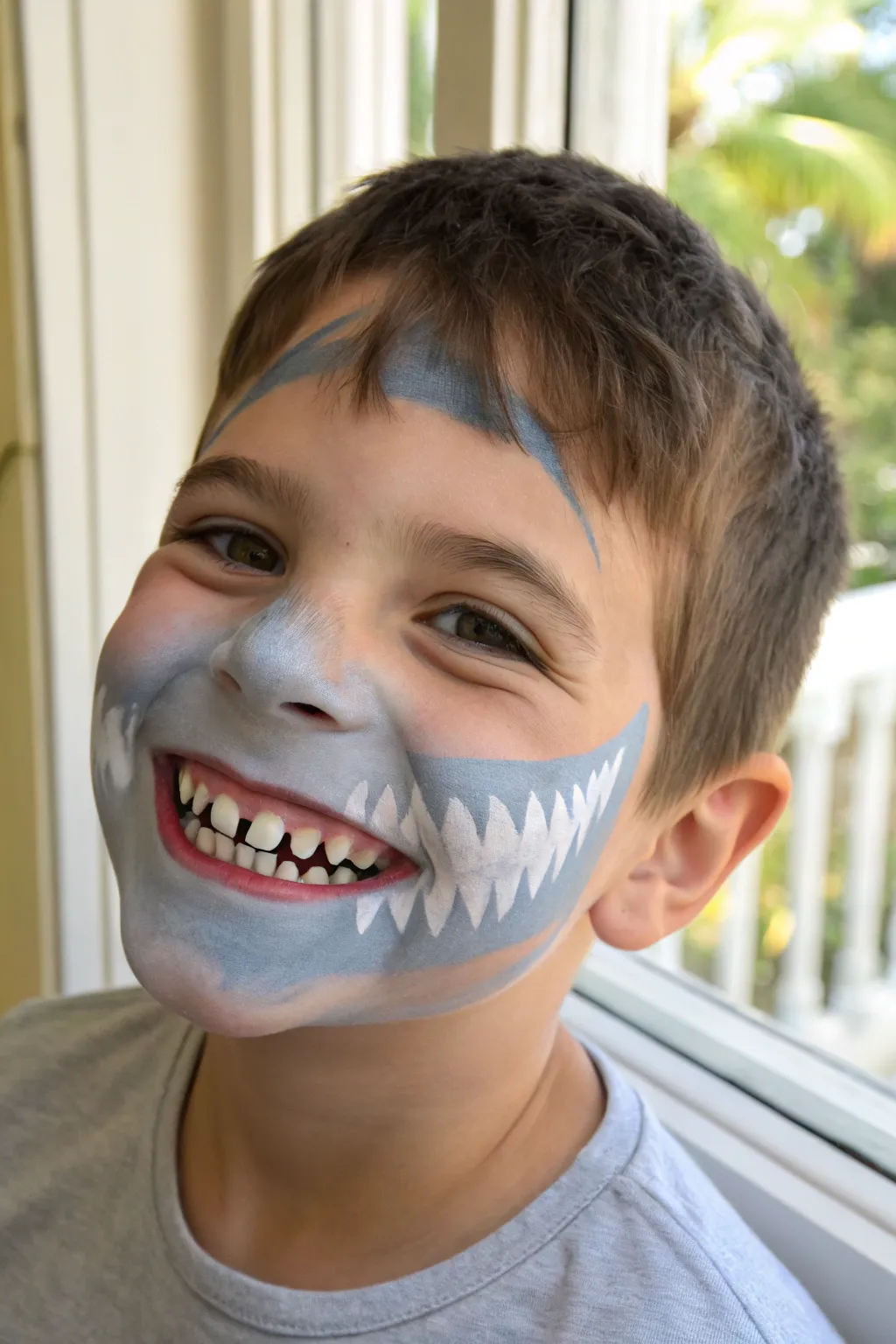 Shark teeth mouth trick face paint: simple ocean wash and crisp white bite illusion