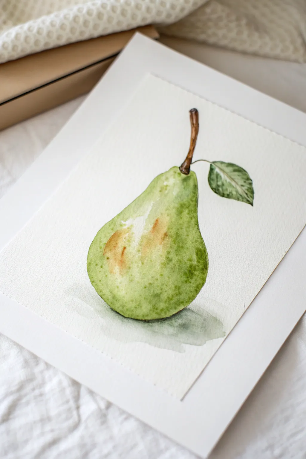 Paint a simple green pear from a teardrop shape with a blush, stem, and leaf.