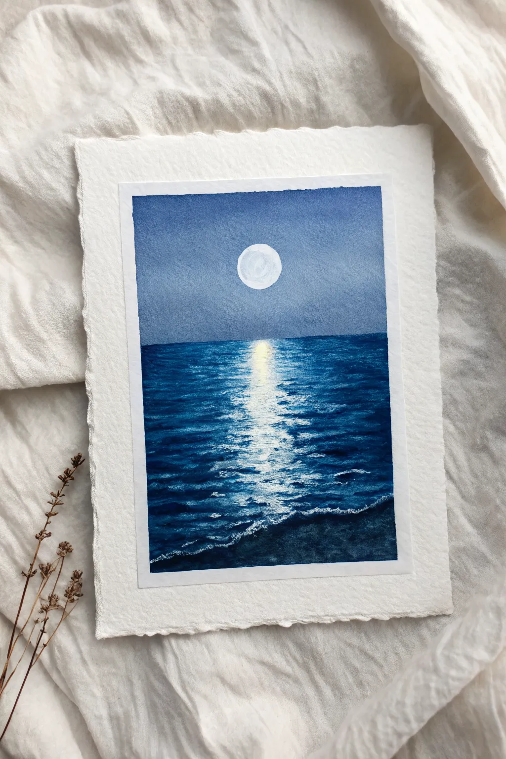 Paint a serene ocean horizon and add a moonlit shimmer path with easy broken strokes.
