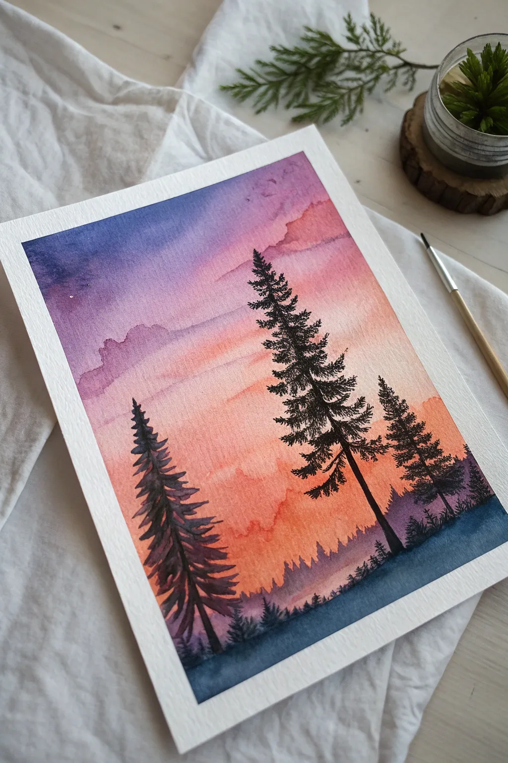 Easy pine tree silhouettes with a vibrant blended sky for a calm, high-contrast scenery