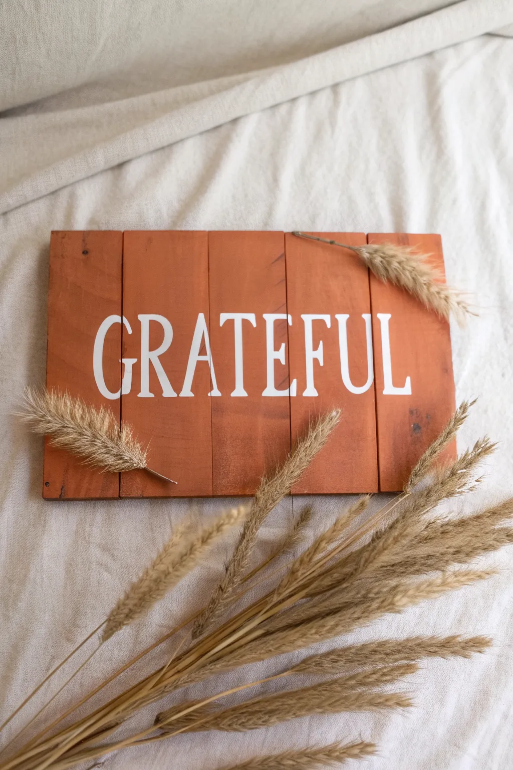 Minimal fall pallet sign idea with bold Grateful lettering and delicate wheat stalk accents.