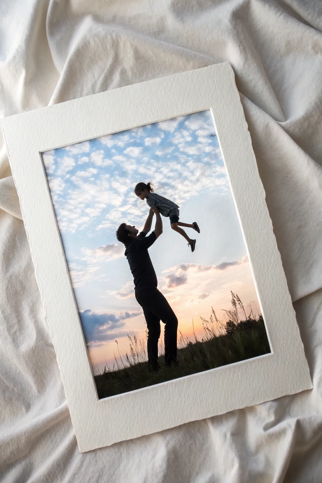 Minimalist watercolor silhouette of dad lifting daughter, bright sky wash and joyful splatter accents