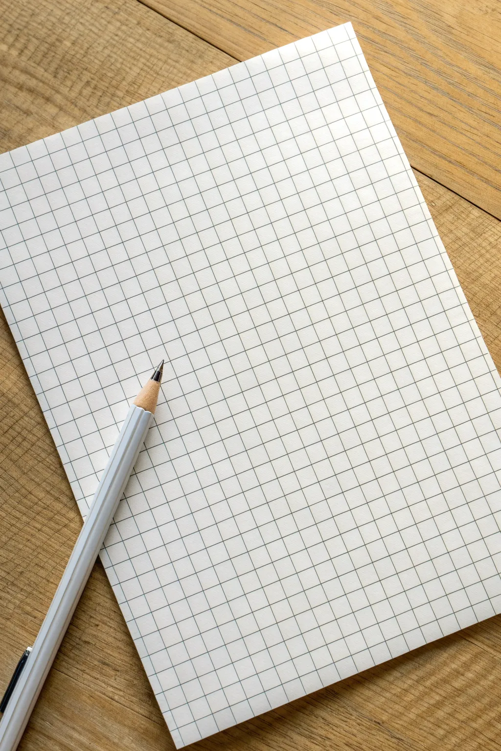 Smooth graphite gradient across graph paper squares, minimalist and calming shading study.