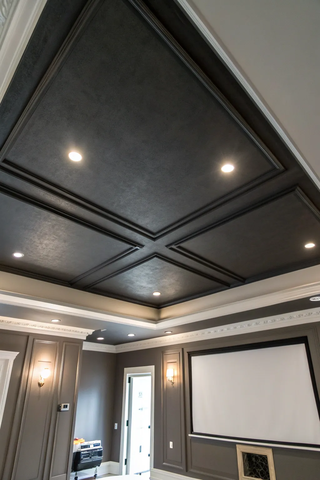Go matte charcoal overhead to tame projector glare and make your media room feel cozy and cinematic.