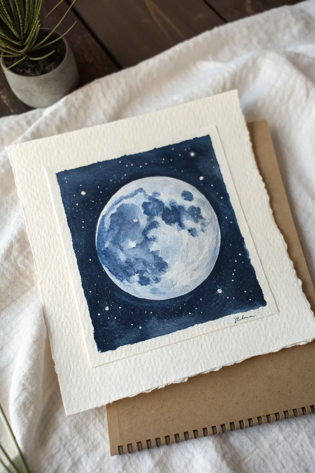 Monochrome indigo moon with soft halos and negative-space stars for a cozy minimalist night