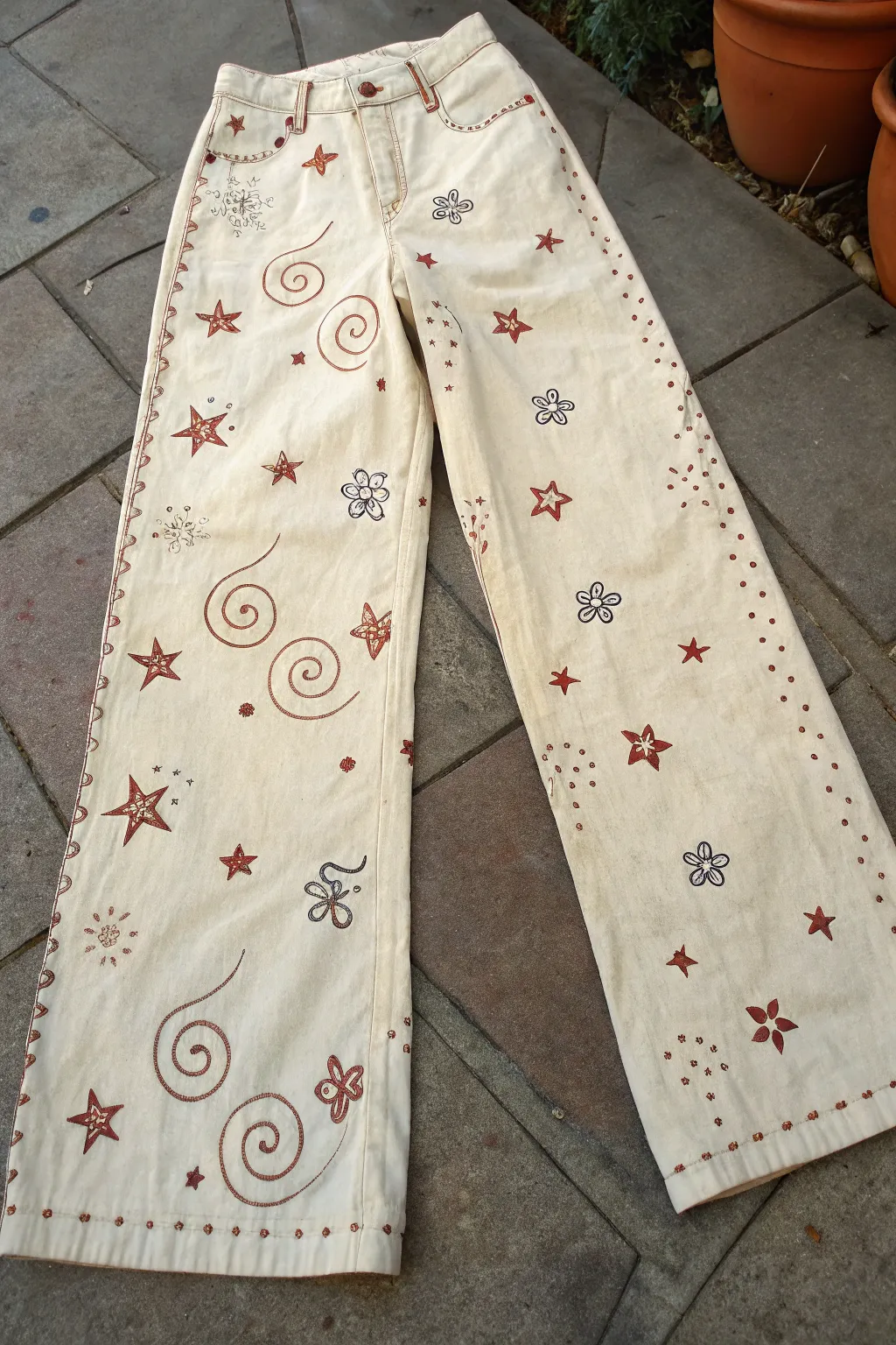 All-over swirls and tiny doodles in a calm palette for minimalist boho painted pants.