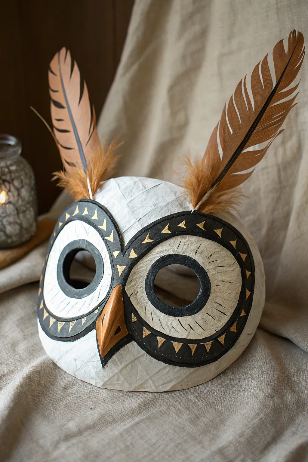 Make a bold owl paper mache mask with oversized eye rings and soft feathered brushstrokes.
